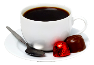 a cup of coffee with chocolates